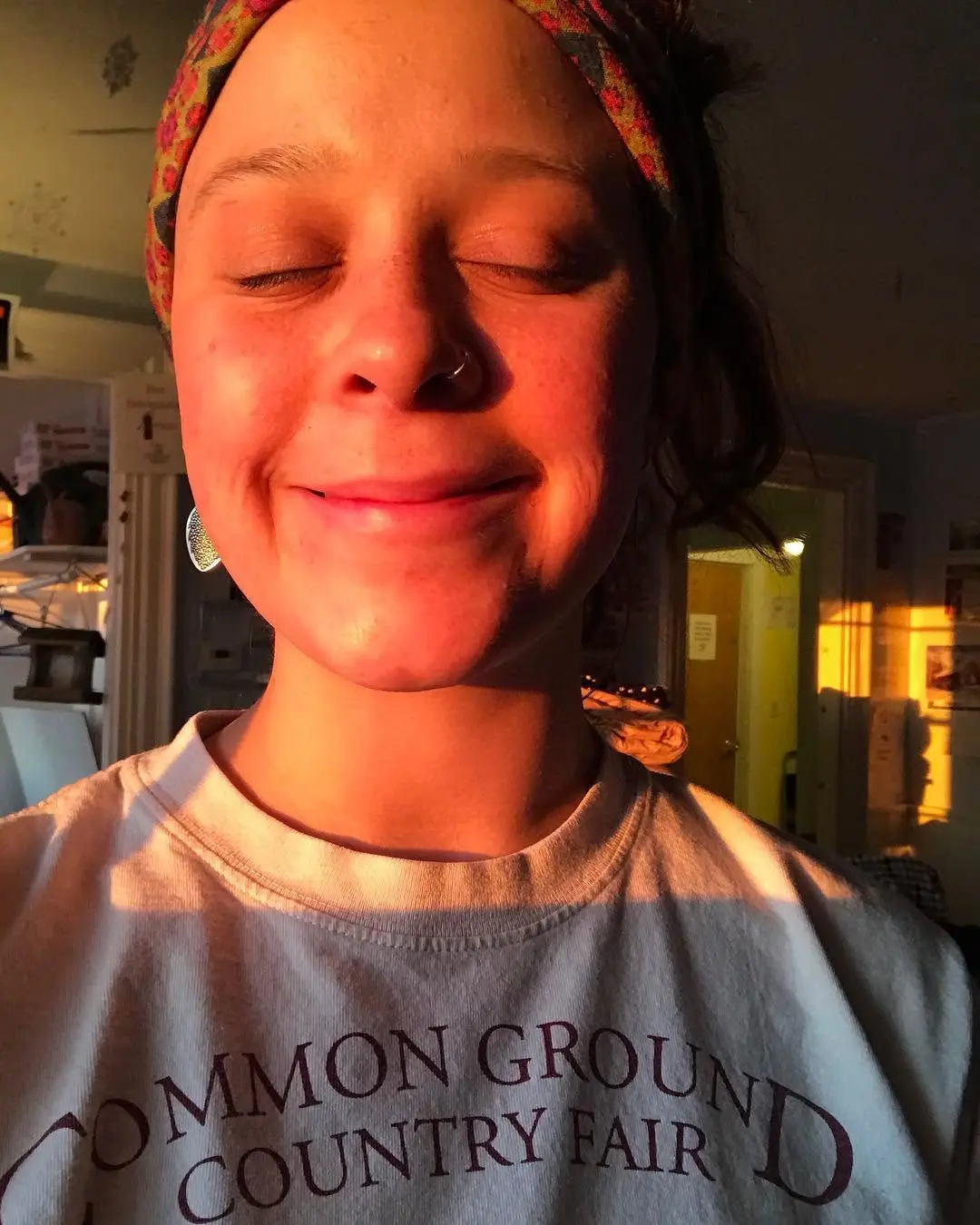 Hannah smiling in warm evening light.