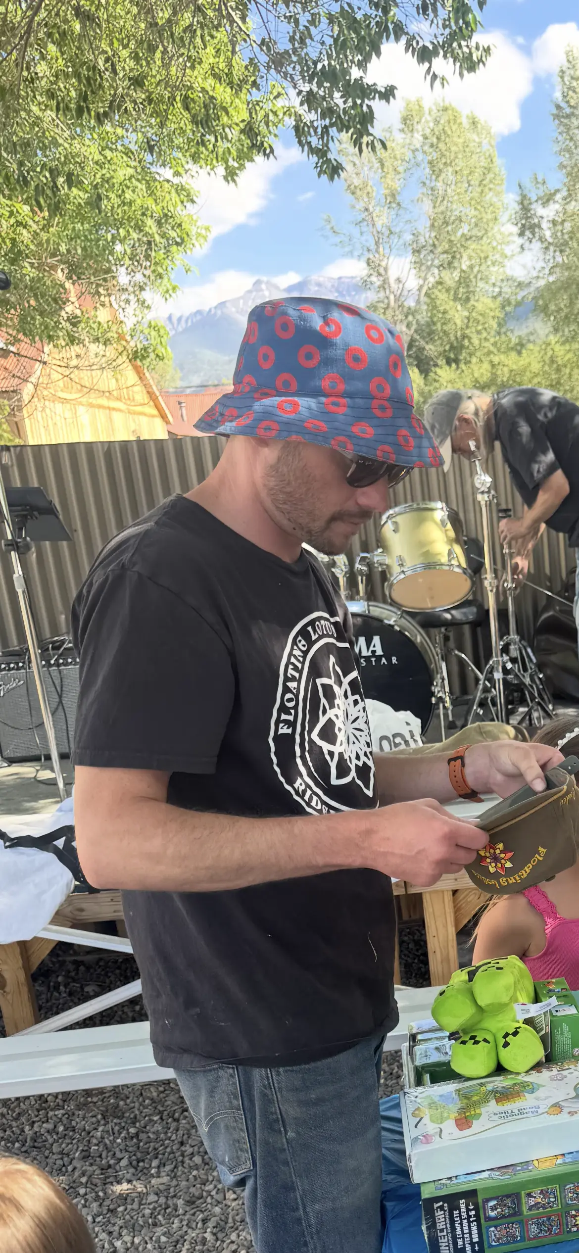 Kenny Conley representing Floating Lotus Brewery at an outdoor event.