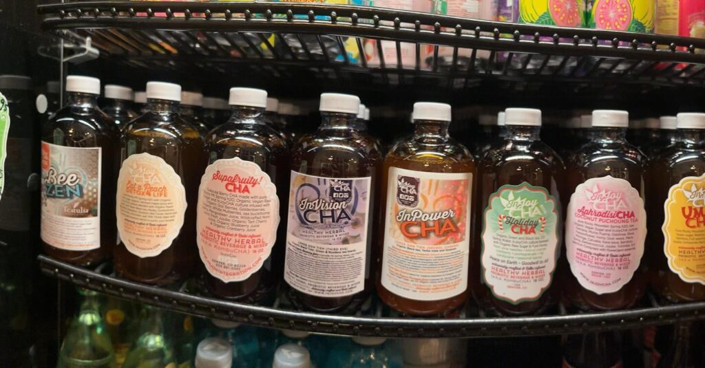 A colorful lineup of bottled InjoyCHA kombucha flavors